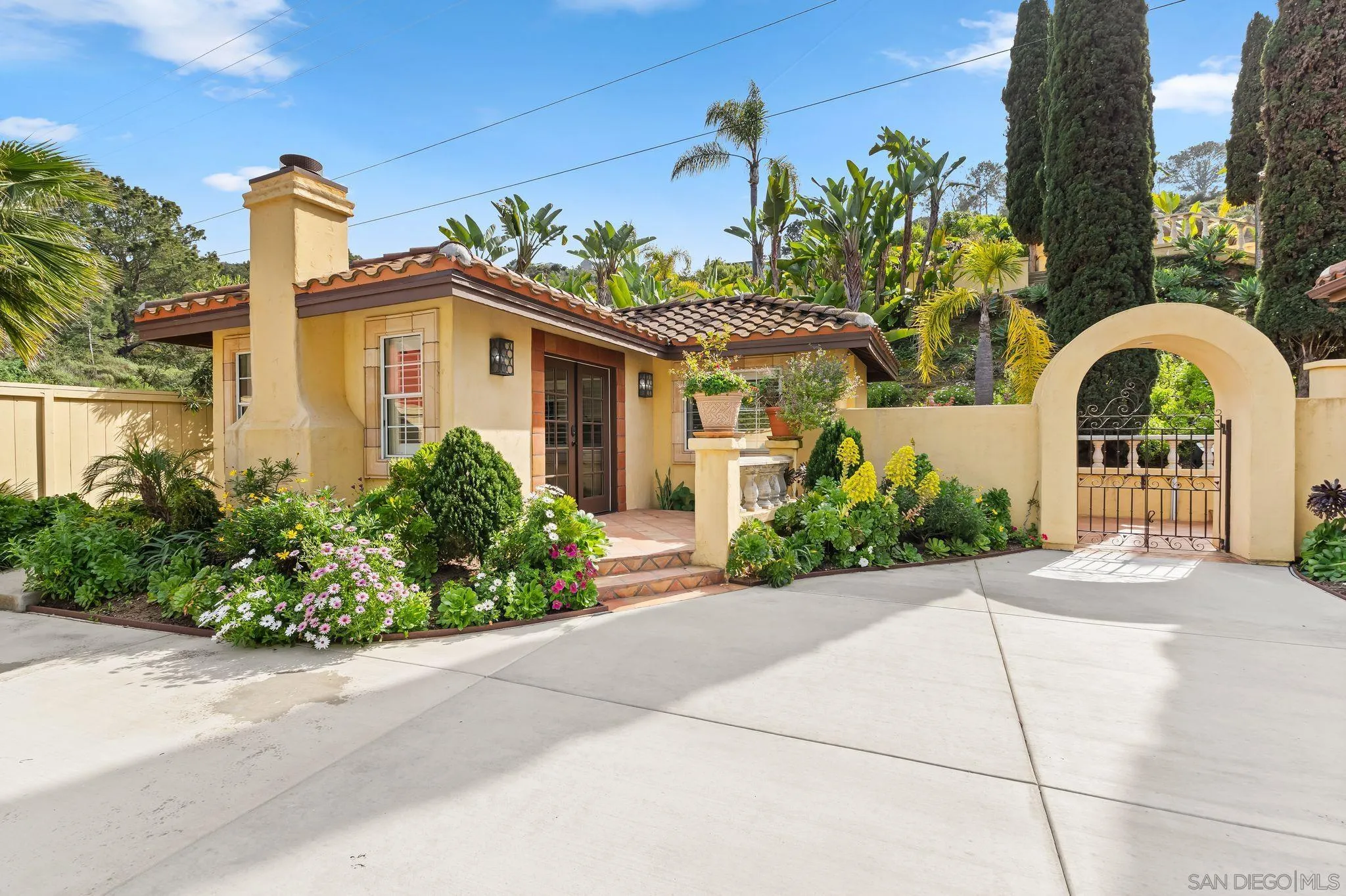 2969 Racetrack View Drive Del Mar, CA 92014 - Photo 50 of 59 a front view of a house with a garden