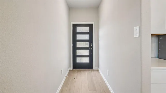 a view of an empty room and window