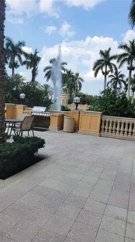 a view of swimming pool with outdoor seating