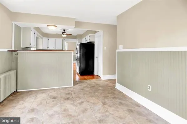 a view of a kitchen with a refrigerator