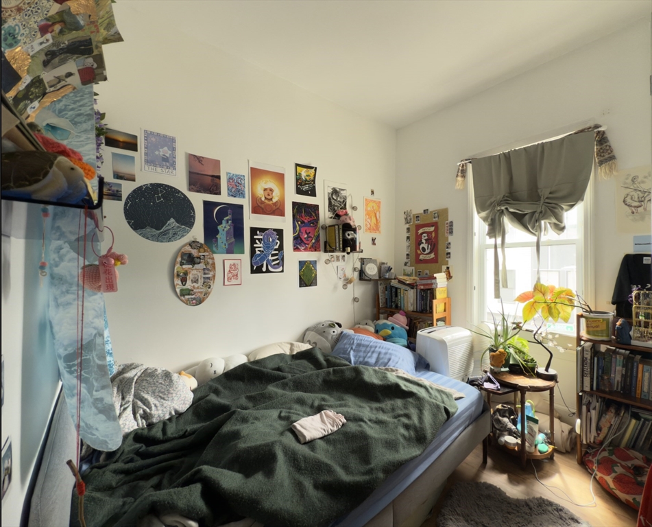 112 South Street, Unit 2 Boston, MA 02130 - Photo 5 of 8 a living room with furniture and a flat screen tv