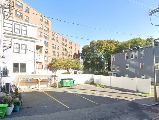 a view of a building with a street