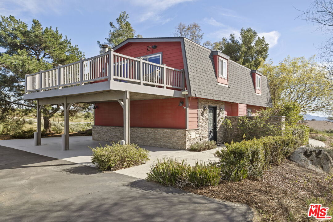 36880 East Benton Road Temecula, CA 92592 - Photo 1 of 75 a front view of a house with a yard