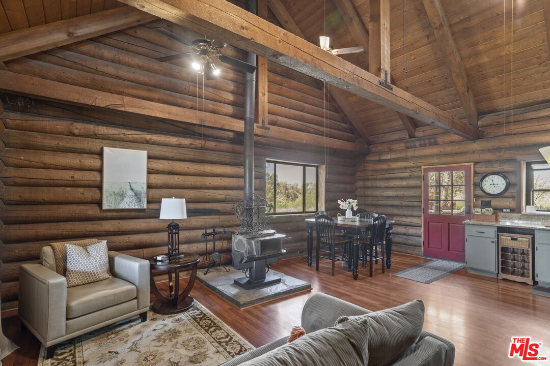 36880 East Benton Road Temecula, CA 92592 - Photo 43 of 75 a living room with furniture and wooden floor