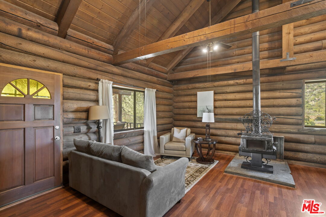 36880 East Benton Road Temecula, CA 92592 - Photo 44 of 75 a living room with furniture and a wooden floor