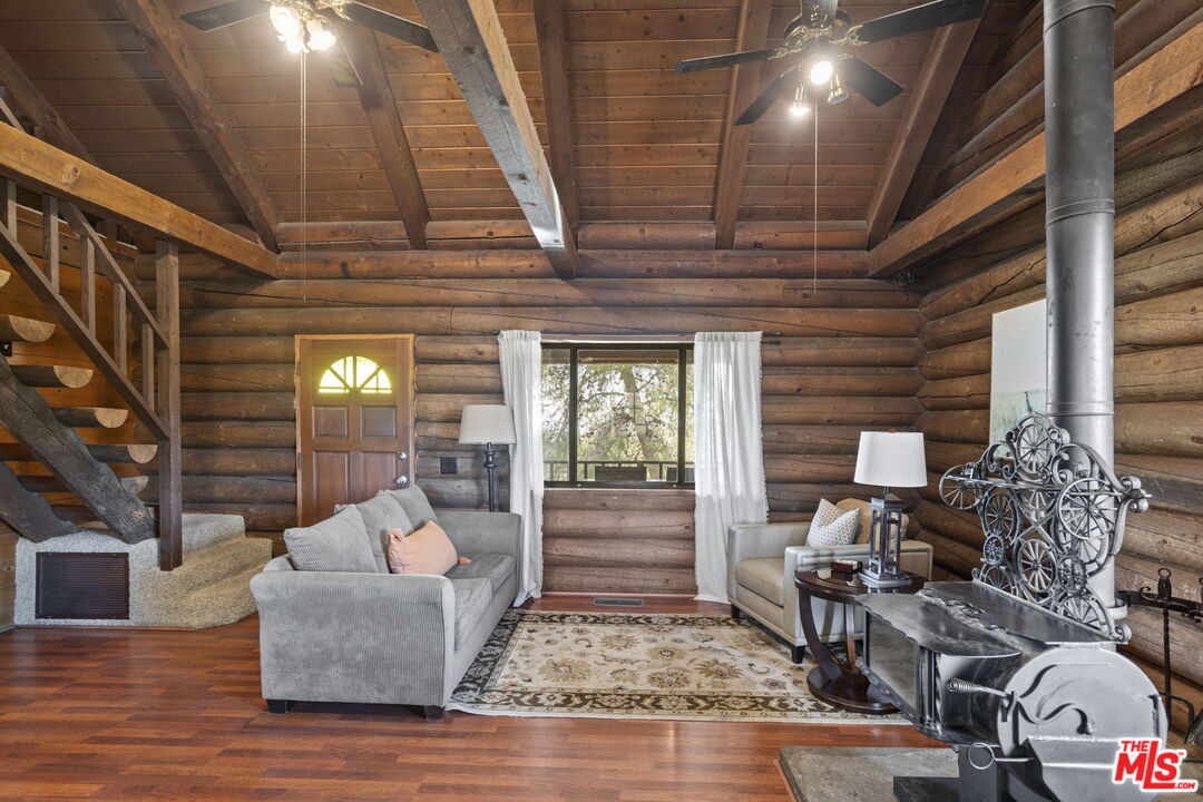 36880 East Benton Road Temecula, CA 92592 - Photo 45 of 75 a living room with furniture and wooden floor
