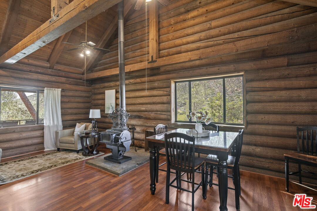 36880 East Benton Road Temecula, CA 92592 - Photo 49 of 75 a view of a dining room with furniture and wooden floor