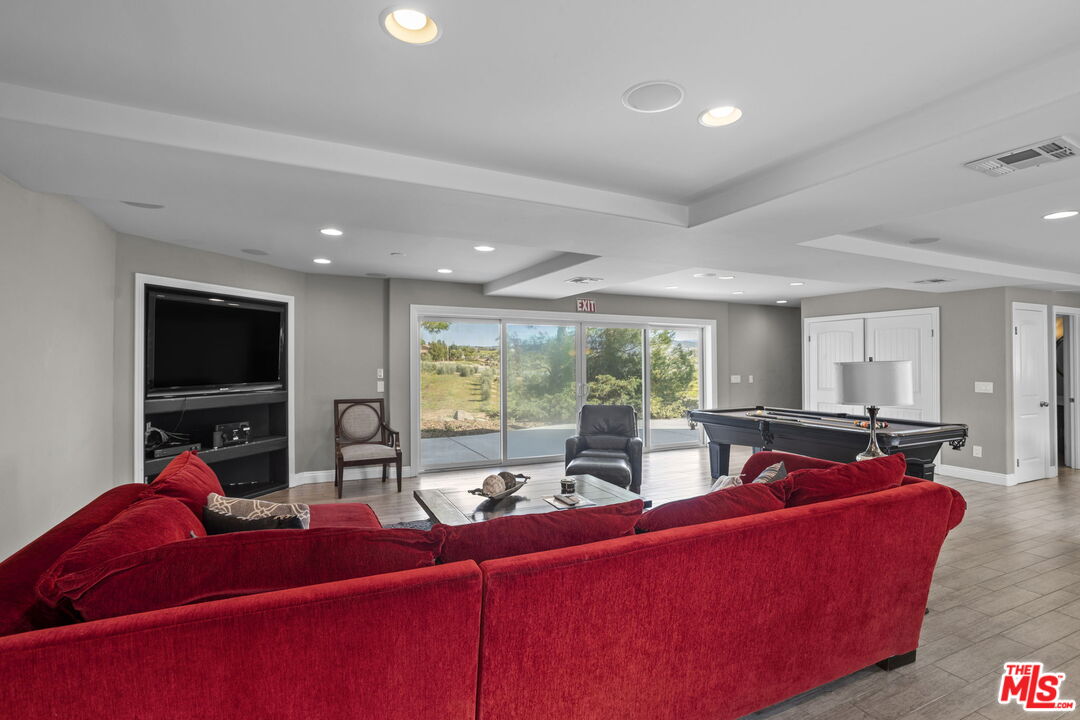 36880 East Benton Road Temecula, CA 92592 - Photo 5 of 75 a living room with furniture and a flat screen tv