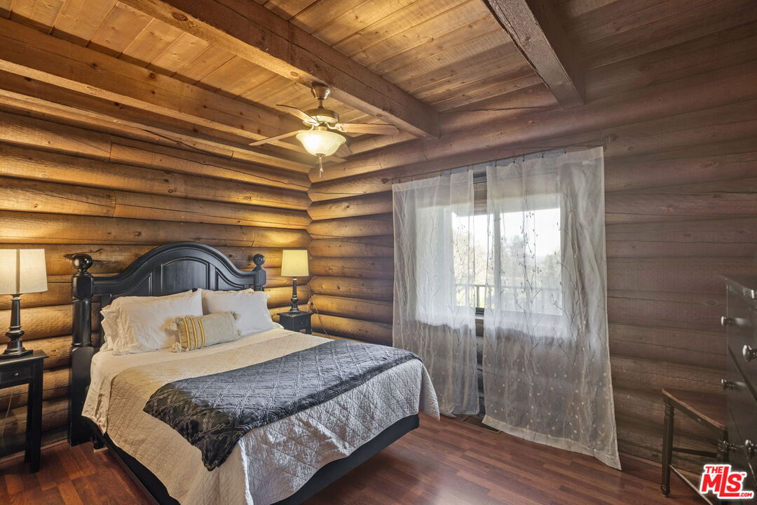 36880 East Benton Road Temecula, CA 92592 - Photo 51 of 75 a bedroom with a bed and a mirror