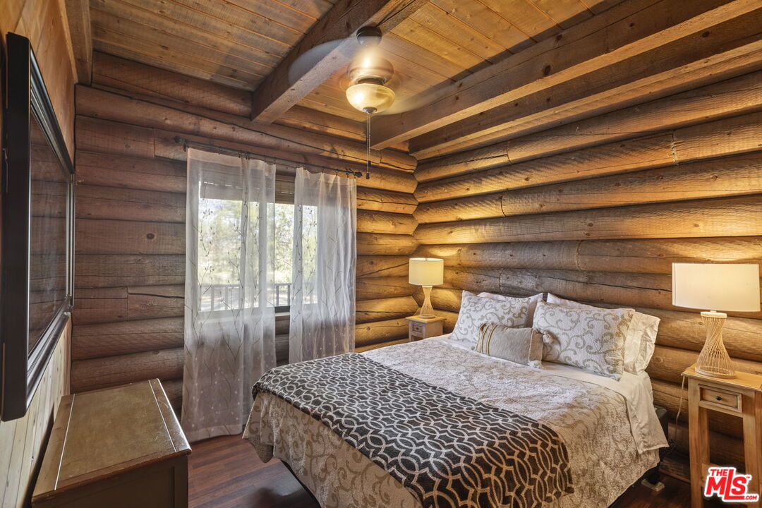 36880 East Benton Road Temecula, CA 92592 - Photo 52 of 75 a bedroom with a bed and a large window