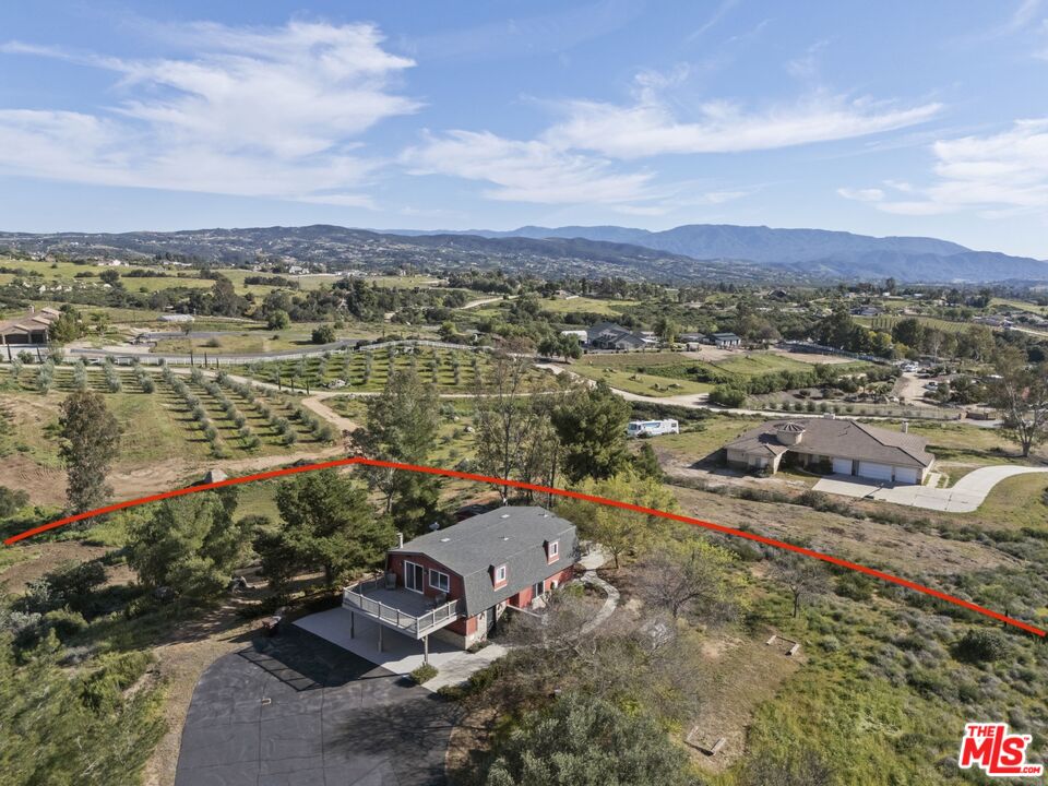 36880 East Benton Road Temecula, CA 92592 - Photo 64 of 75 an aerial view of a house with a lake view