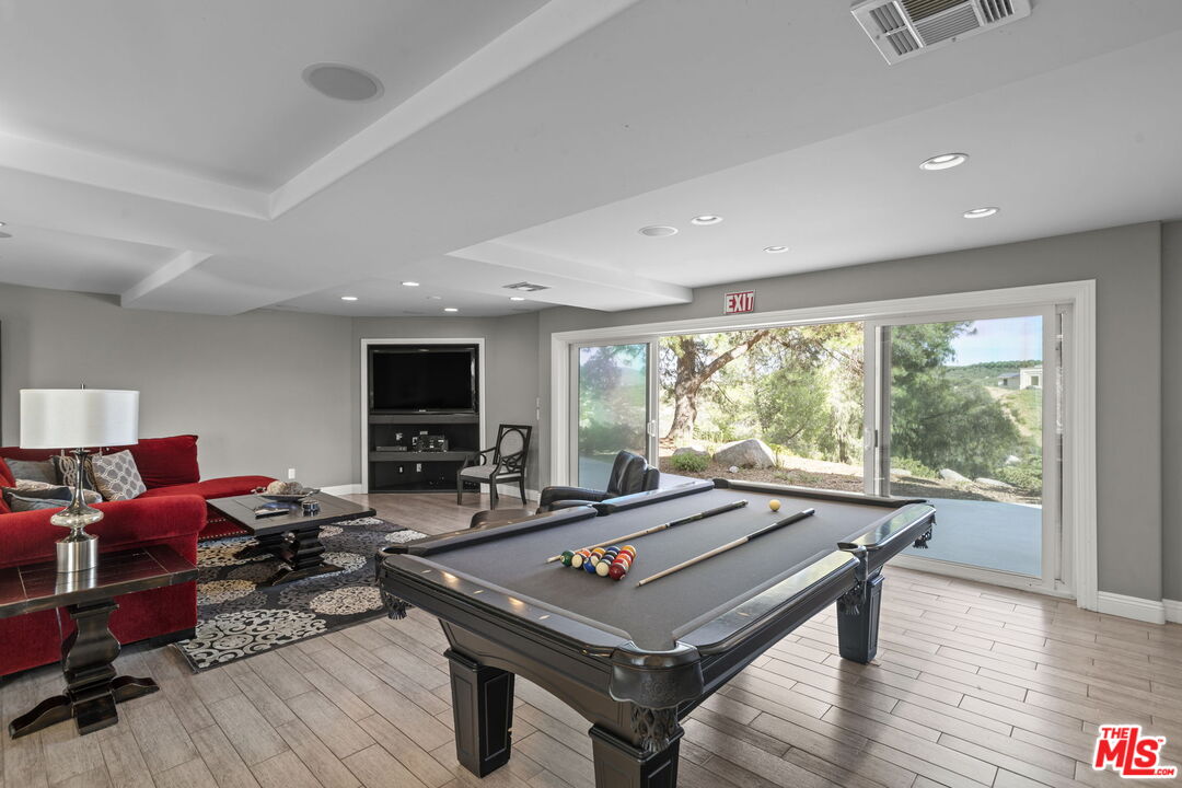 36880 East Benton Road Temecula, CA 92592 - Photo 7 of 75 a living room with furniture a flat screen tv and a large window