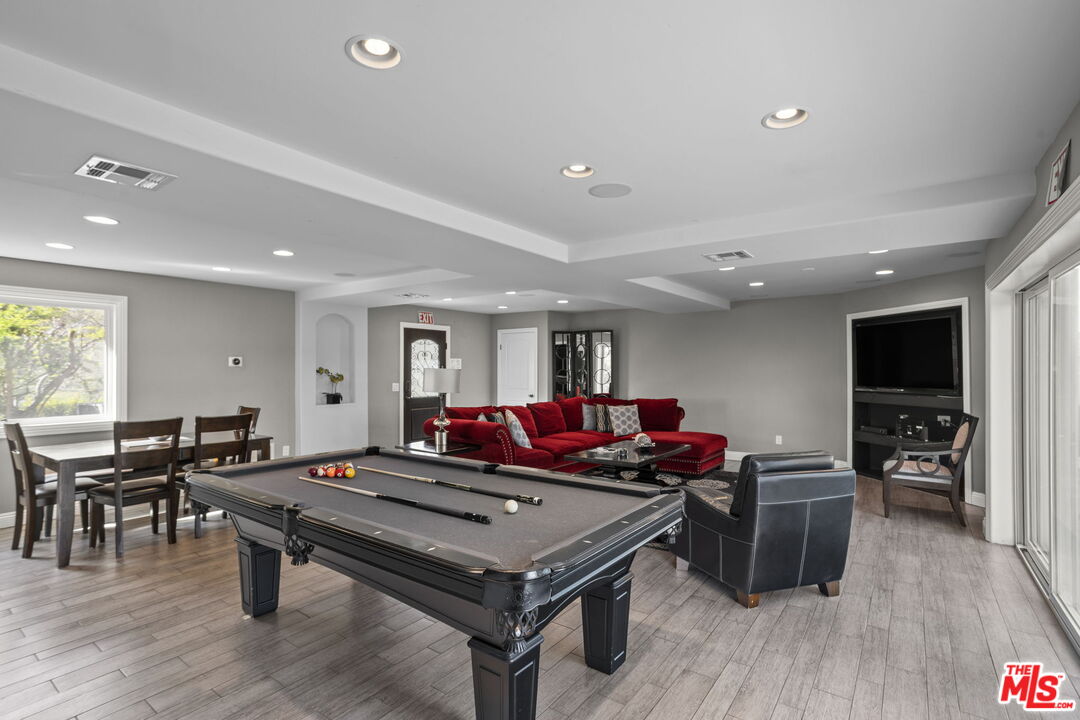 36880 East Benton Road Temecula, CA 92592 - Photo 10 of 75 a living room with furniture pool table flat screen tv and windows
