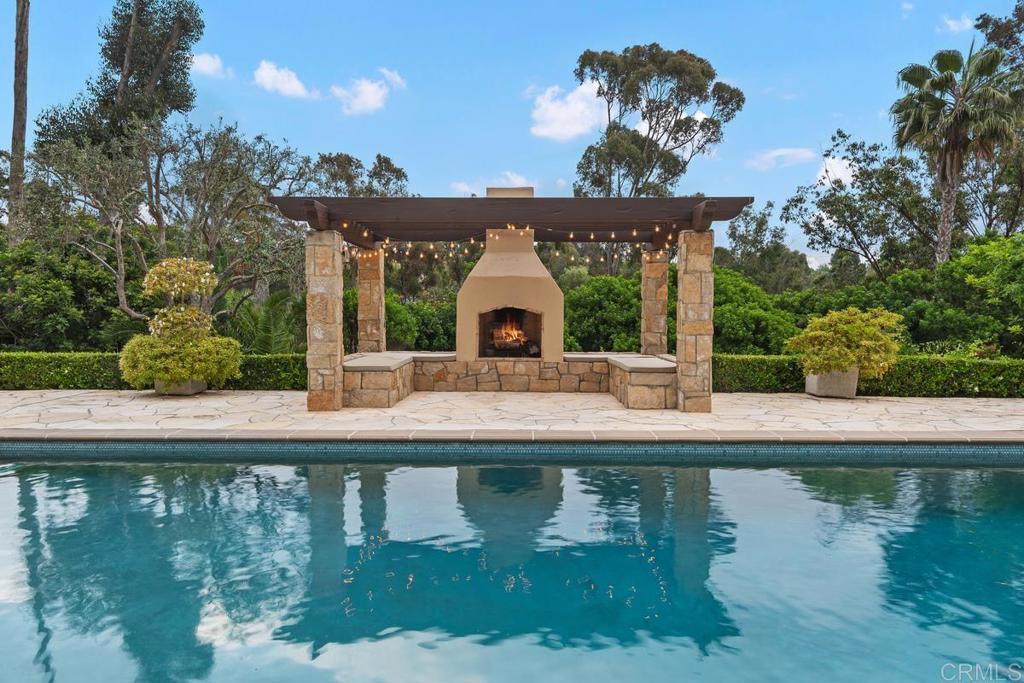 5315 La Crescenta Road Rancho Santa Fe, CA 92067 - Photo 13 of 17 a view of a house with a swimming pool