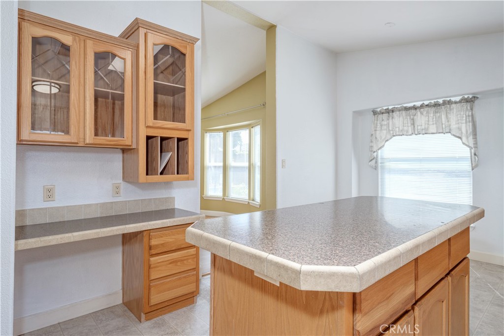 209 Rd Runner Lane Fountain Valley, CA 92708 - Photo 13 of 38 a kitchen with a sink a stove and chandelier