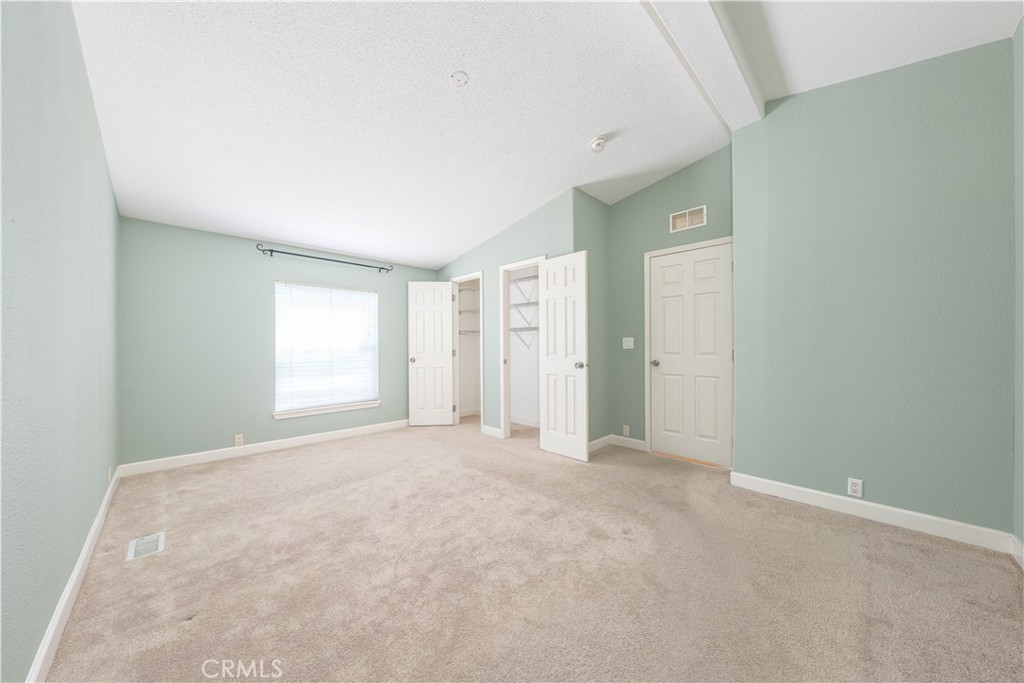 209 Rd Runner Lane Fountain Valley, CA 92708 - Photo 15 of 38 an empty room with windows and closet