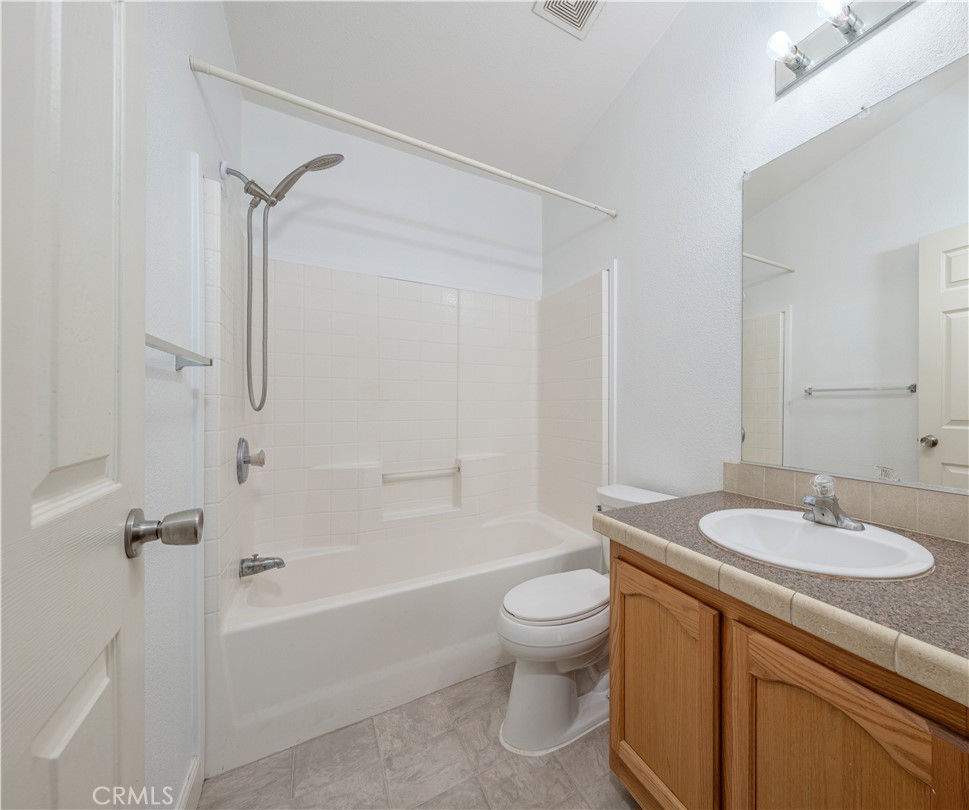 209 Rd Runner Lane Fountain Valley, CA 92708 - Photo 23 of 38 a bathroom with a sink toilet and shower