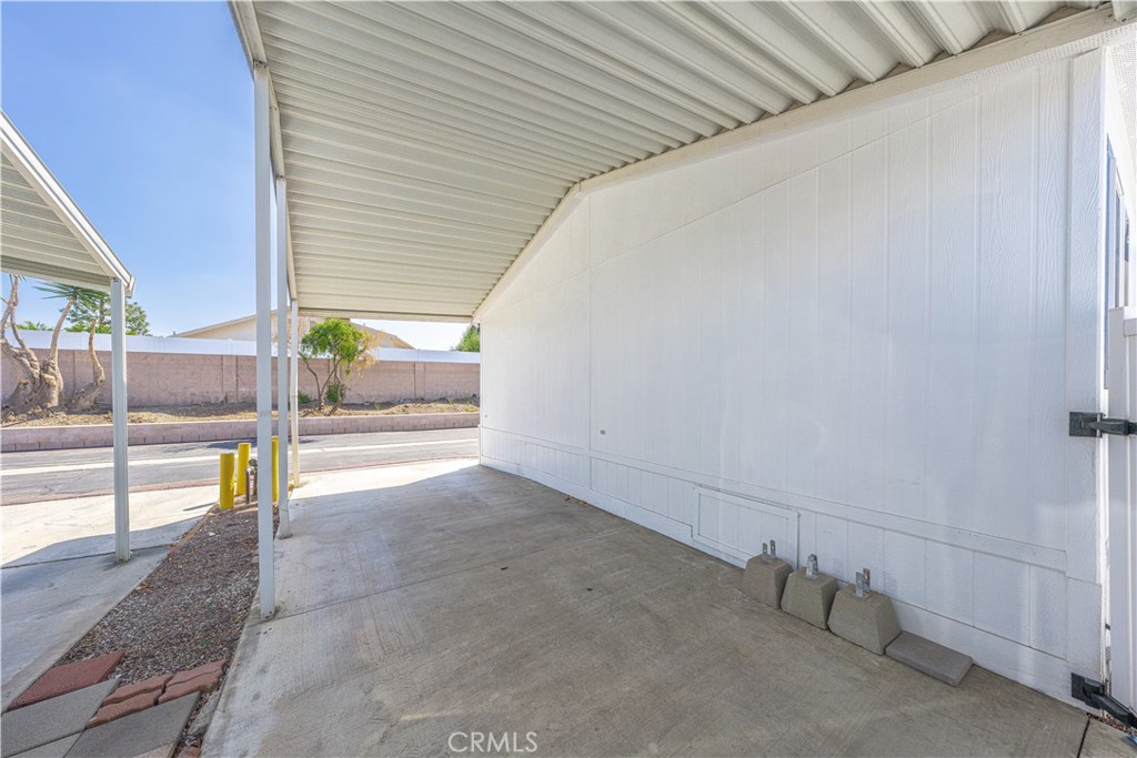 209 Rd Runner Lane Fountain Valley, CA 92708 - Photo 30 of 38 a view of a porch and a floor to ceiling window