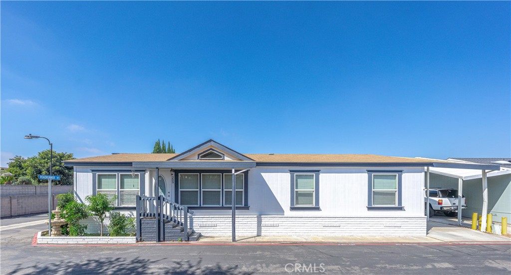 209 Rd Runner Lane Fountain Valley, CA 92708 - Photo 4 of 38 a front view of a house with garden