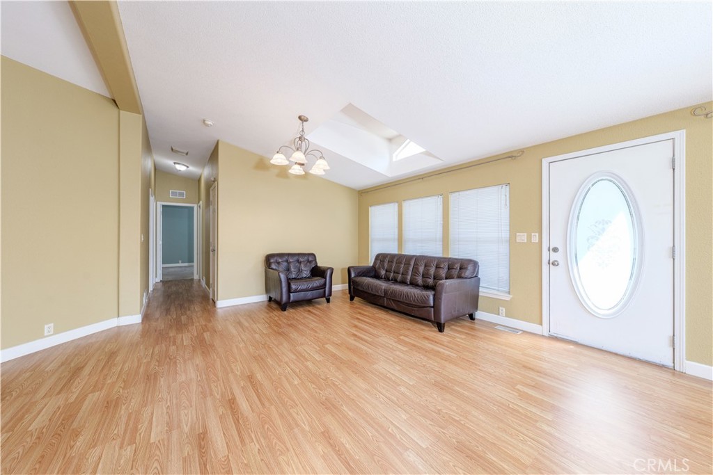 209 Rd Runner Lane Fountain Valley, CA 92708 - Photo 9 of 38 a living room with furniture and a fireplace