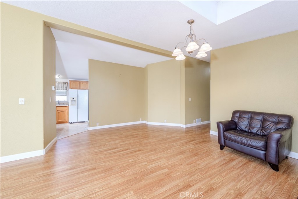 209 Rd Runner Lane Fountain Valley, CA 92708 - Photo 10 of 38 a view of livingroom with hardwood floor and a ceiling fan
