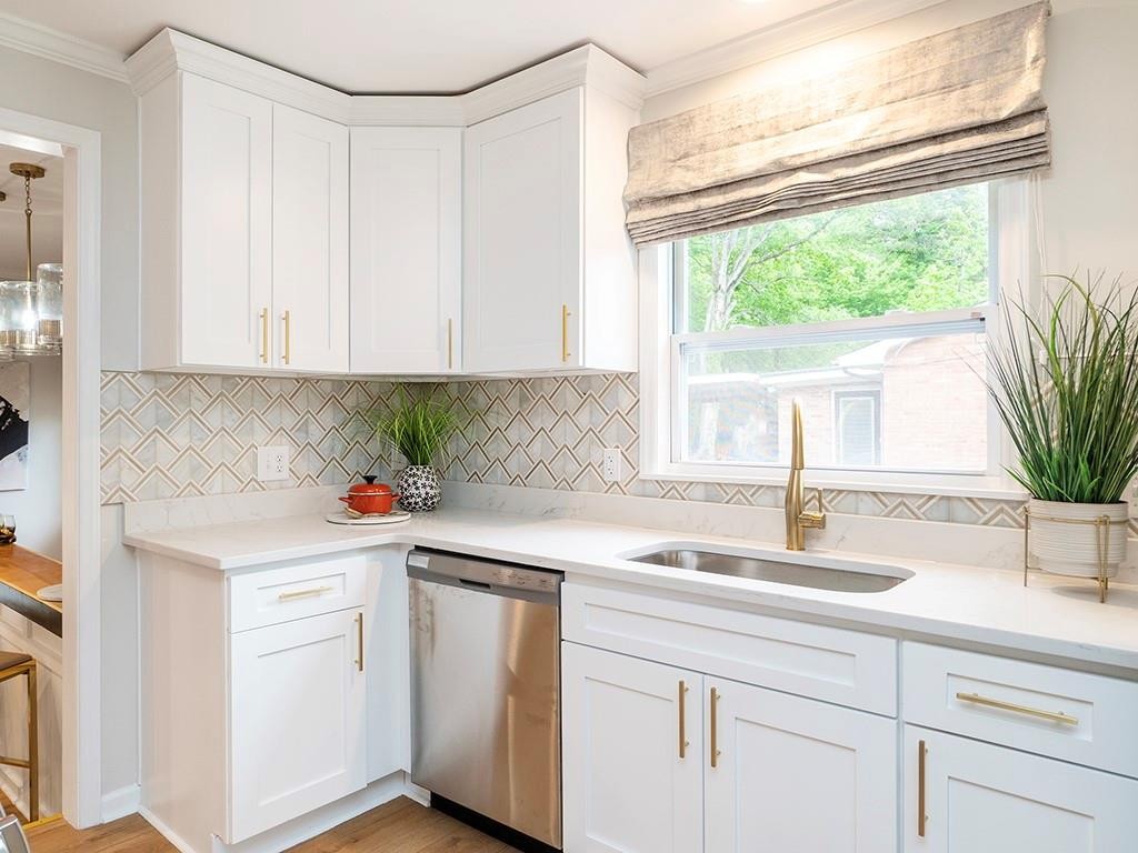 1720 Elder Way Burlington, NC 27215 - Photo 12 of 34 a kitchen with a sink and cabinets