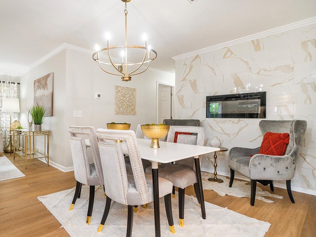 1720 Elder Way Burlington, NC 27215 - Photo 13 of 34 a view of a dining room with furniture and wooden floor