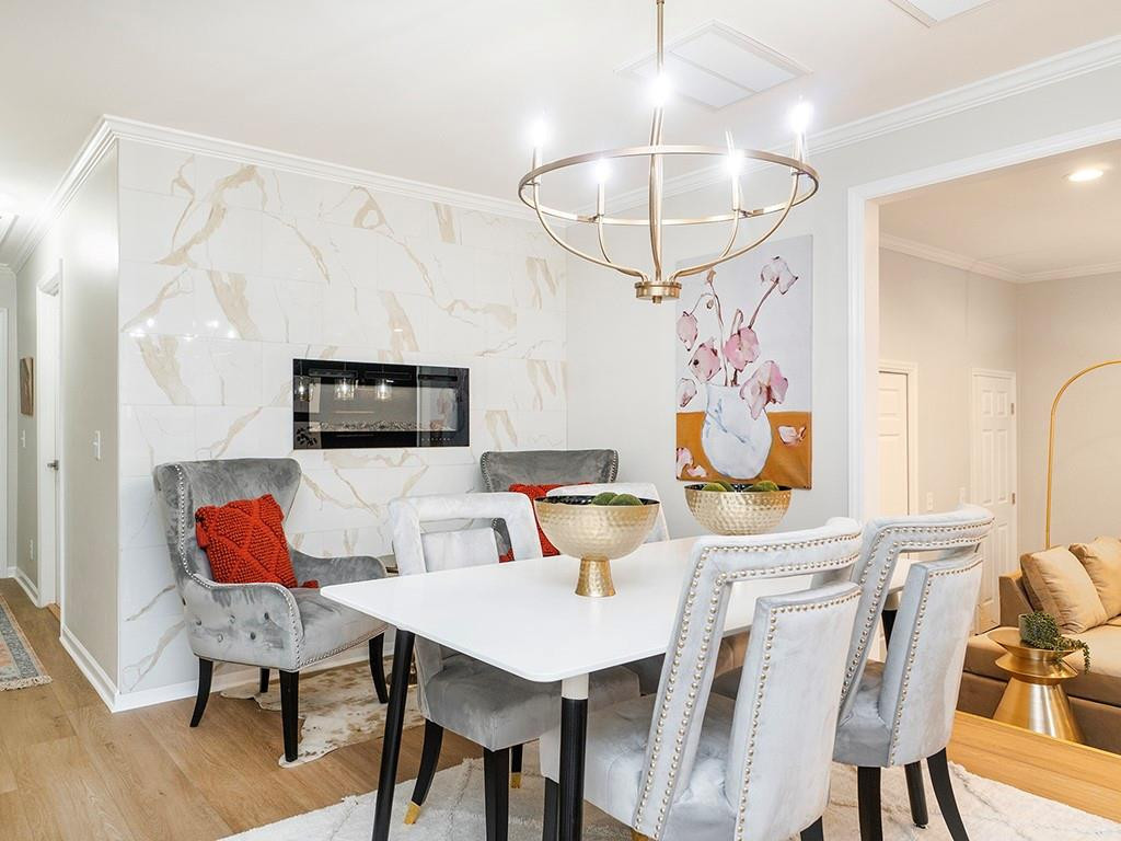 1720 Elder Way Burlington, NC 27215 - Photo 14 of 34 a view of a dining room with furniture and wooden floor