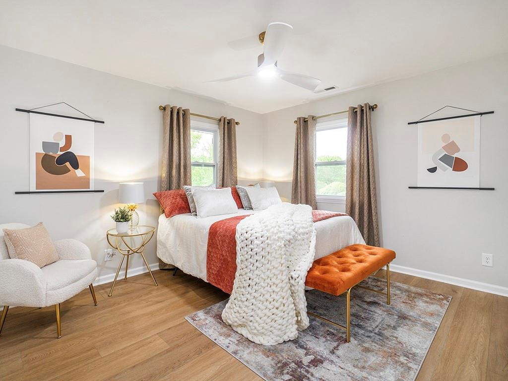 1720 Elder Way Burlington, NC 27215 - Photo 22 of 34 a bed room with a bed and a chair