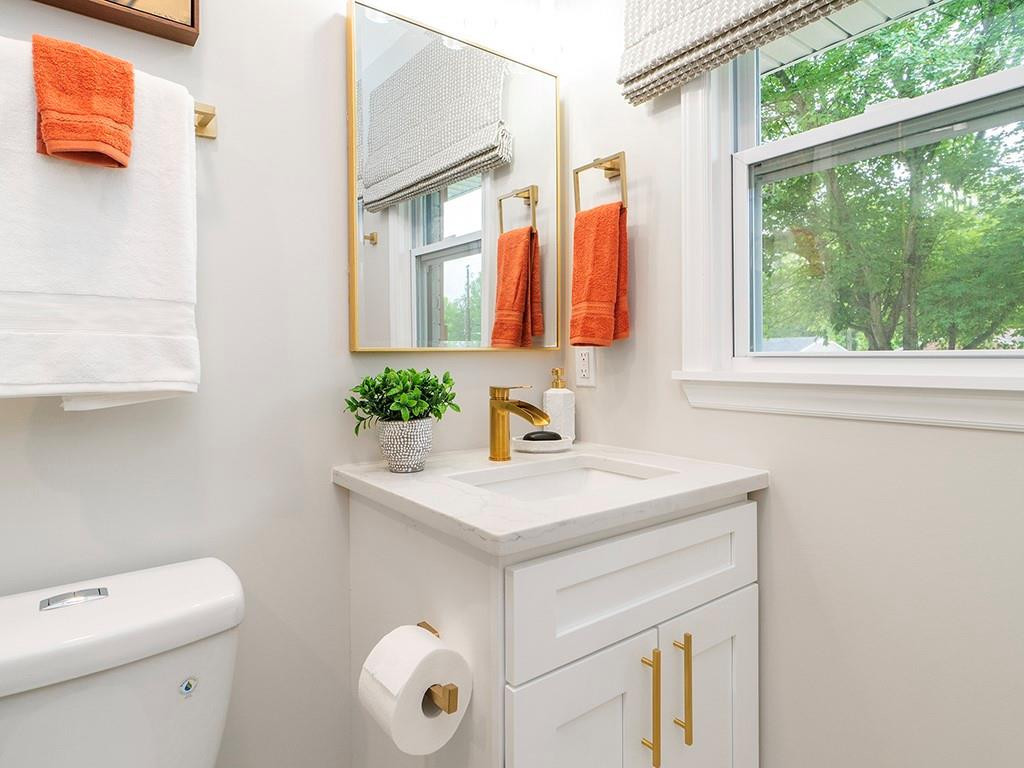 1720 Elder Way Burlington, NC 27215 - Photo 25 of 34 a bathroom with a sink vanity granite toilet and a mirror