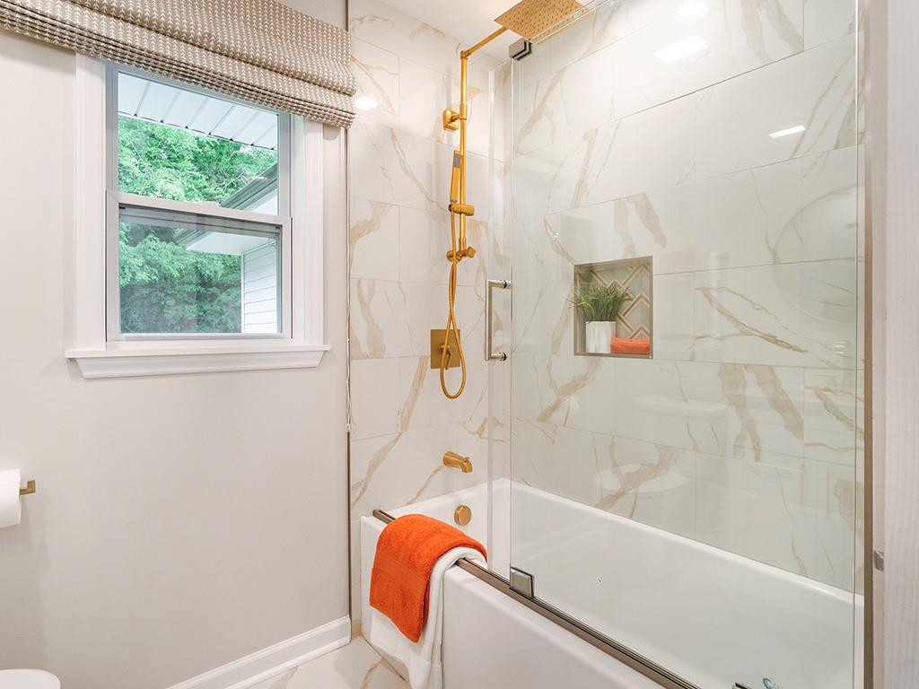 1720 Elder Way Burlington, NC 27215 - Photo 29 of 34 a bathroom with a tub and a shower