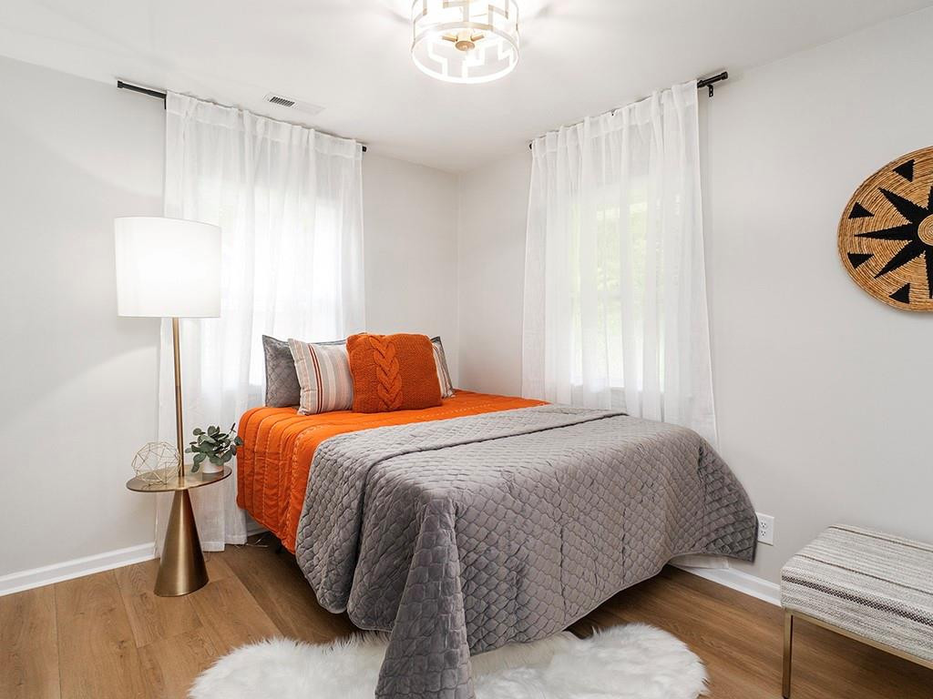 1720 Elder Way Burlington, NC 27215 - Photo 30 of 34 a bedroom with a bed and a window