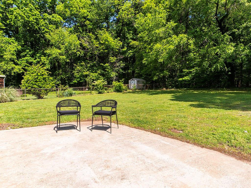 1720 Elder Way Burlington, NC 27215 - Photo 31 of 34 a park with a bench and trees in the background