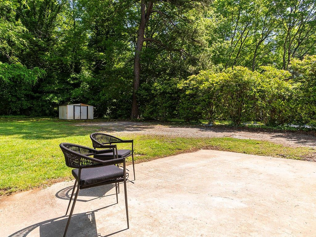 1720 Elder Way Burlington, NC 27215 - Photo 32 of 34 a view of swimming pool with table and chairs under an umbrella