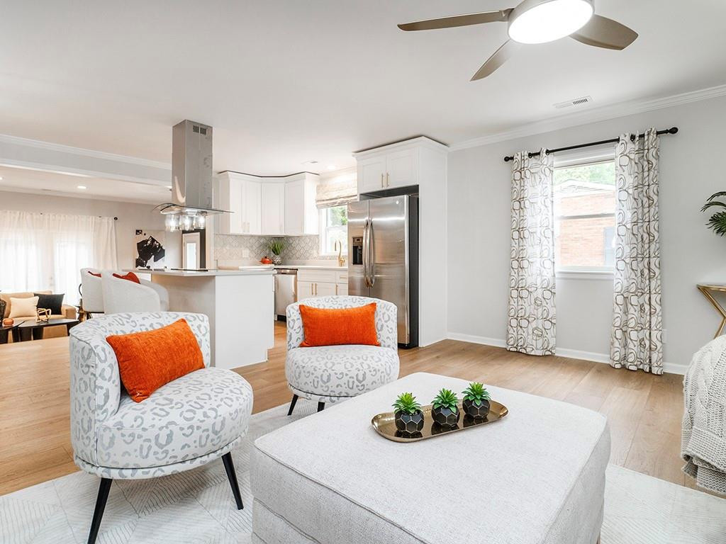 1720 Elder Way Burlington, NC 27215 - Photo 8 of 34 a bedroom with furniture and a wooden floor