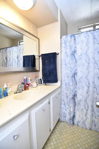 a bathroom with a sink and a mirror