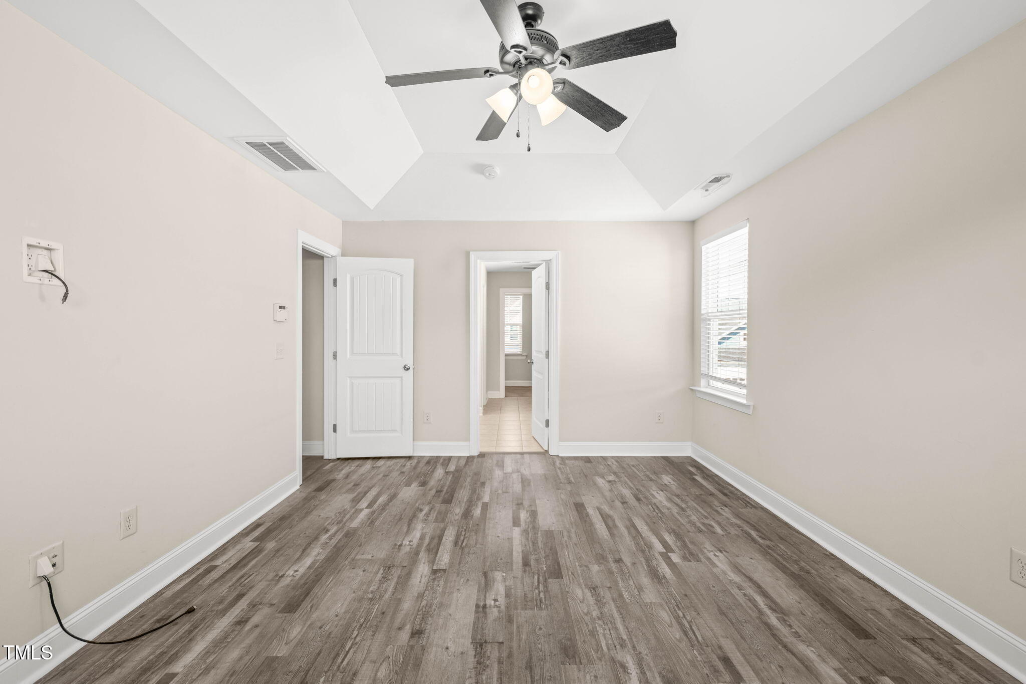 4508 Brintons Cottage Street Raleigh, NC 27616 - Photo 23 of 46 wooden floor in an empty room with a window