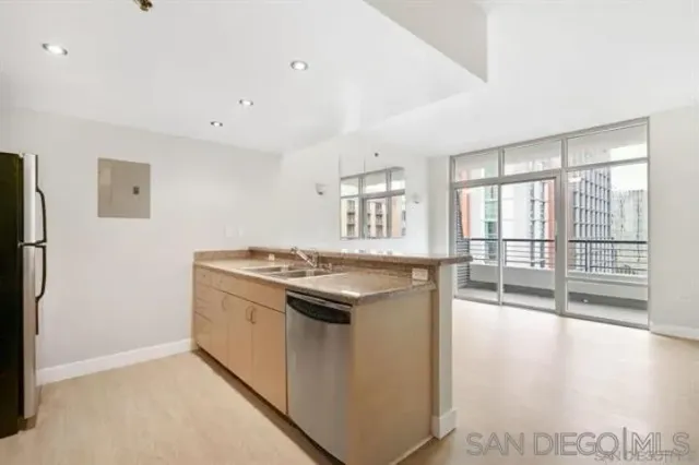 a kitchen with a stove and a refrigerator