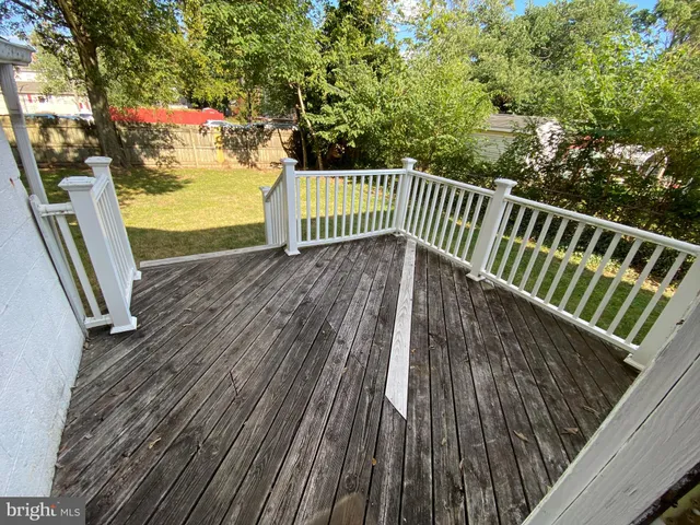 a view of balcony with wooden floor