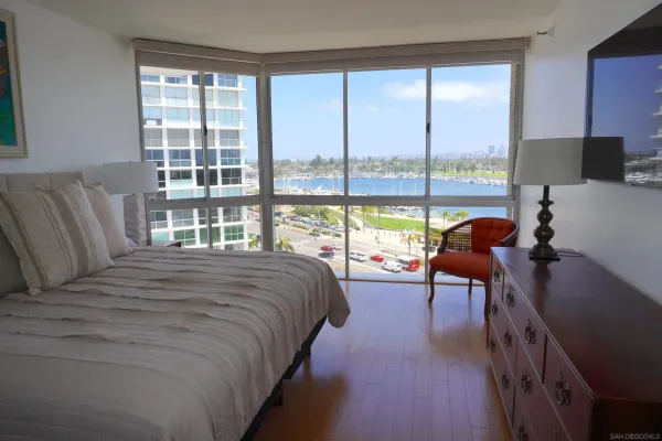a bedroom with a bed and a night stand