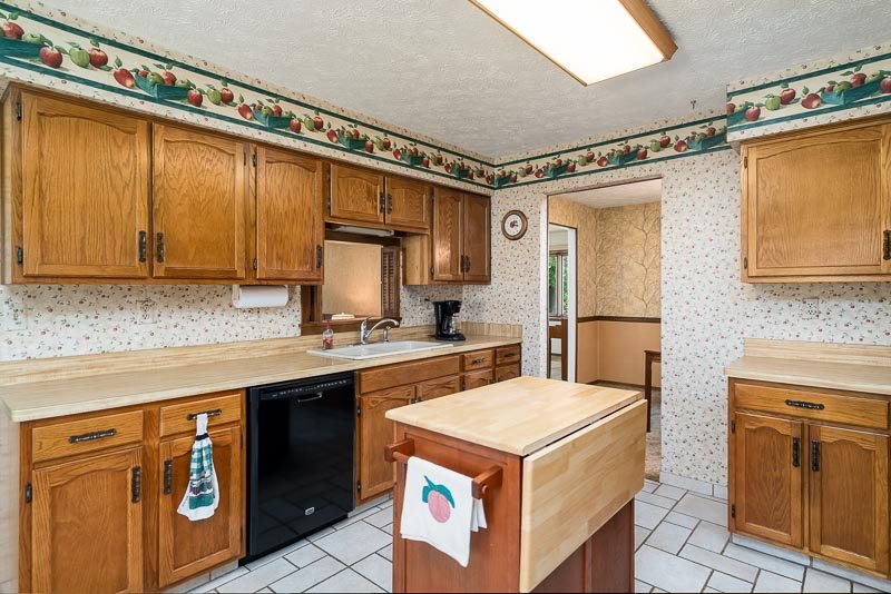 3644 Cutty Sark Road Cherry Valley, IL 61016 - Photo 11 of 33 a kitchen with a stove top oven sink and cabinets