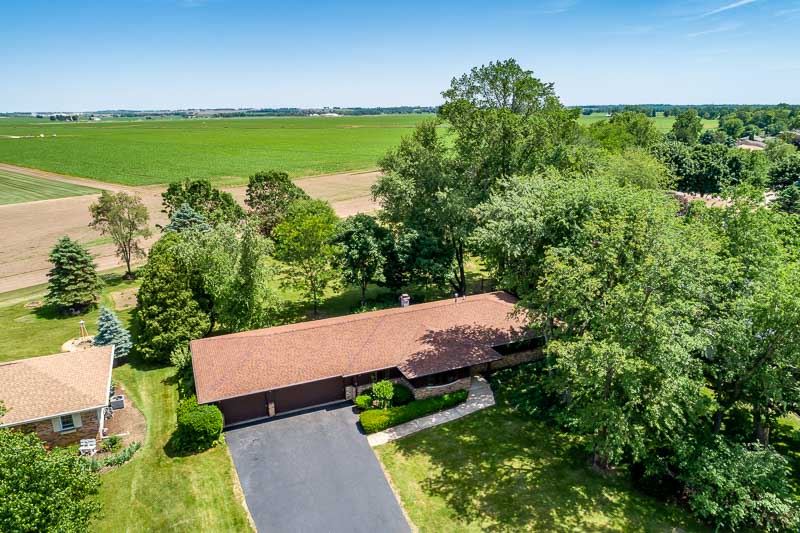 3644 Cutty Sark Road Cherry Valley, IL 61016 - Photo 2 of 33 an aerial view of a house with a yard basket ball court and outdoor seating