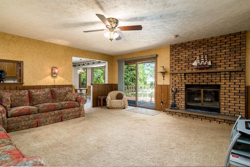 3644 Cutty Sark Road Cherry Valley, IL 61016 - Photo 6 of 33 a living room with furniture and a fireplace