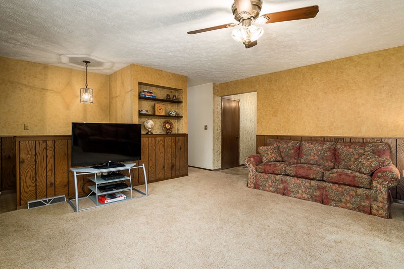 3644 Cutty Sark Road Cherry Valley, IL 61016 - Photo 8 of 33 a view of a livingroom with furniture and a flat screen tv