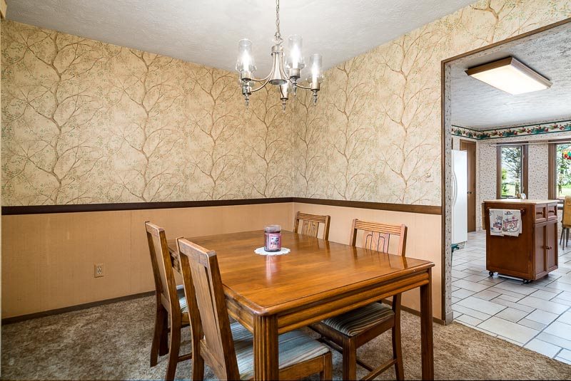3644 Cutty Sark Road Cherry Valley, IL 61016 - Photo 10 of 33 a view of a dining room with furniture and chandelier