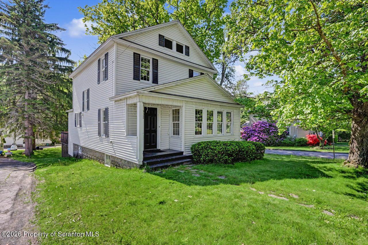 502 Layton Road Clarks Summit, PA 18411 - Photo 1 of 42 a front view of a house with a yard and garage
