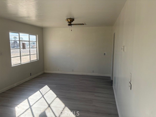 451 West Yermo Road Yermo, CA 92398 - Photo 11 of 23 wooden floor in an empty room with a window