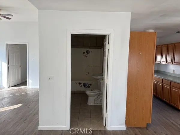 a view of a kitchen from the hallway
