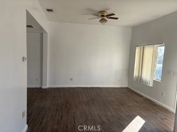 a view of an empty room with a window