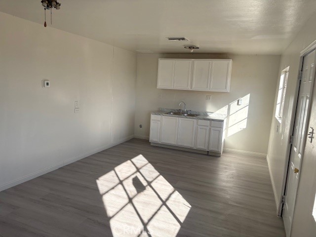 451 West Yermo Road Yermo, CA 92398 - Photo 4 of 23 an empty room with wooden floor and windows